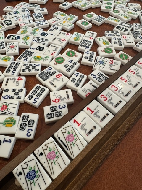 Men playing mahjong at a table